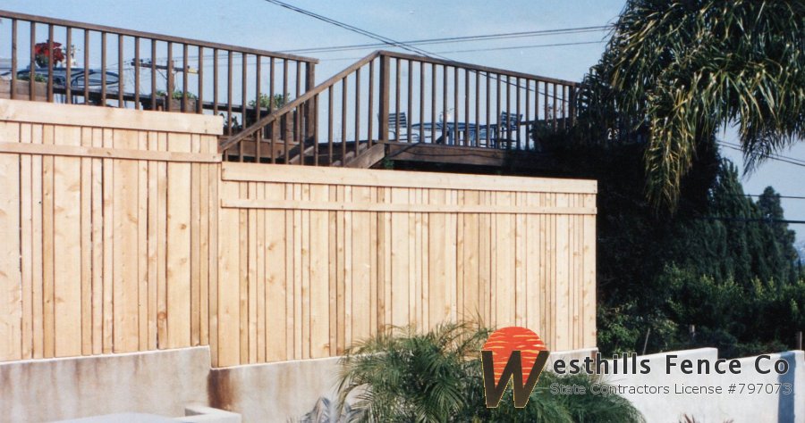Custom wood fence on the top of the wall