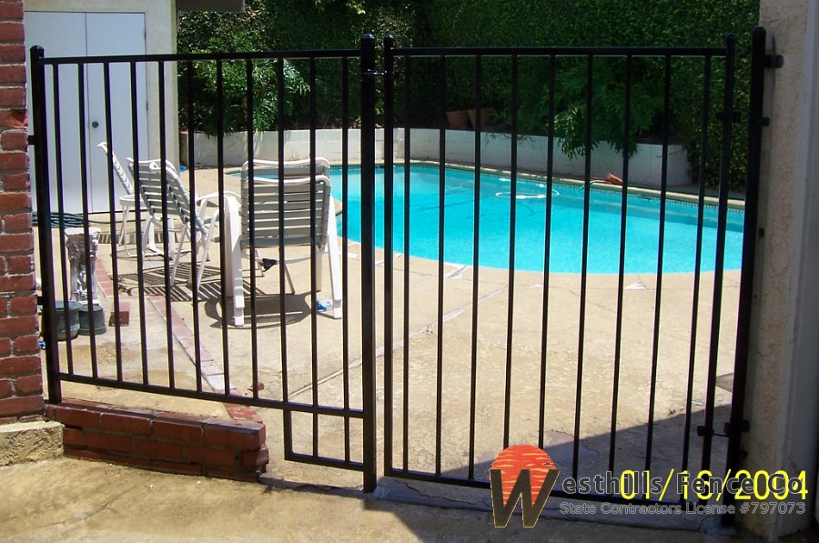 Black regal iron fence and gate