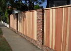 Tongue and groove redwood with brick posts.JPG