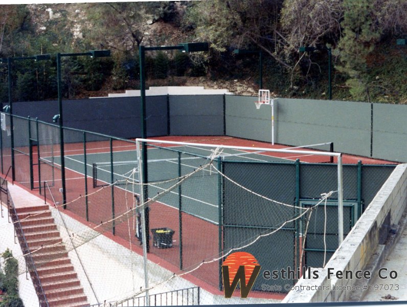 Green chain-link tennis court