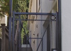 Custom iron gate with mesh.JPG