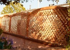 Arch redwood lattice on the top of the wall.JPG