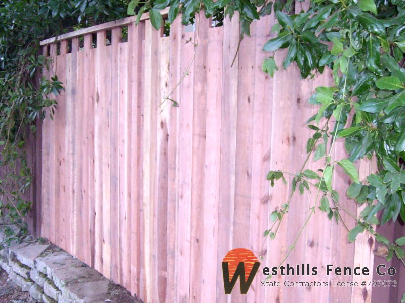 High low butted board fence with 2x4 cap