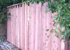 High low butted board fence with 2x4 cap.JPG